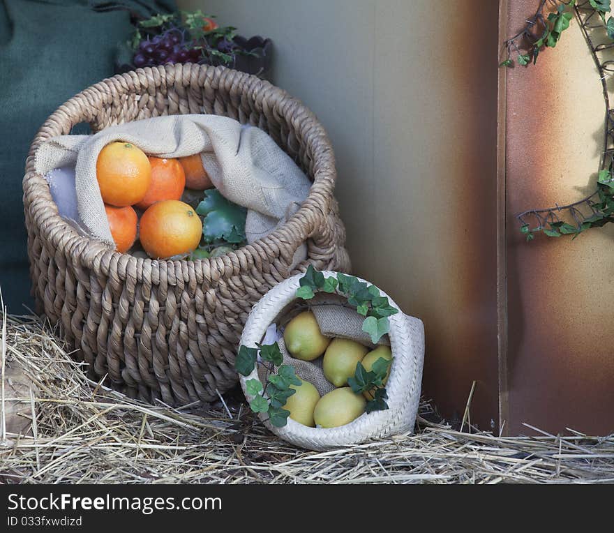 baskets of oranges and lemons in a rural environment. baskets of oranges and lemons in a rural environment