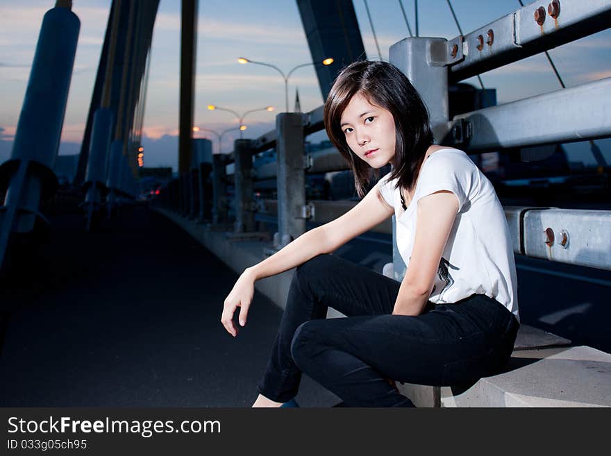 Fashion photos on the bridge in the evening. Fashion photos on the bridge in the evening.