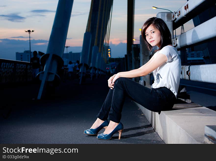 Fashion photos on the bridge in the evening. Fashion photos on the bridge in the evening.