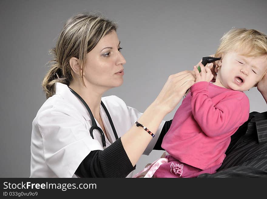 Doctor examining white girl