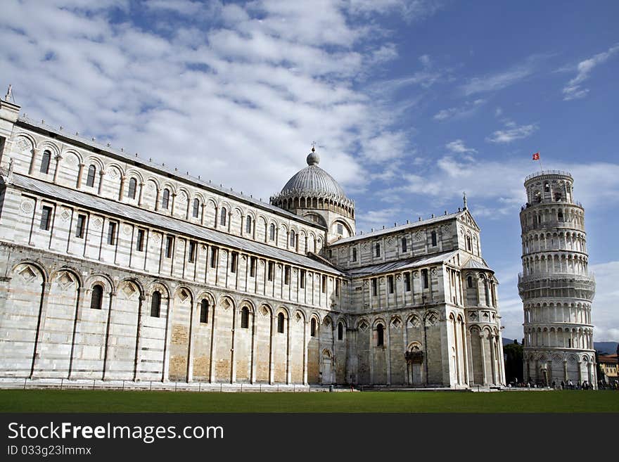 Piazza del Duomo (Piazza dei Miracoli) with famous landmarks of Pisa - Duomo cathedral and leaning tower. It is UNESCO World Heritage Site.