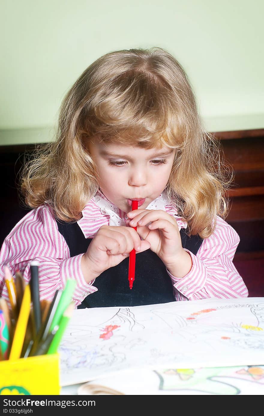 Cute little girl painting