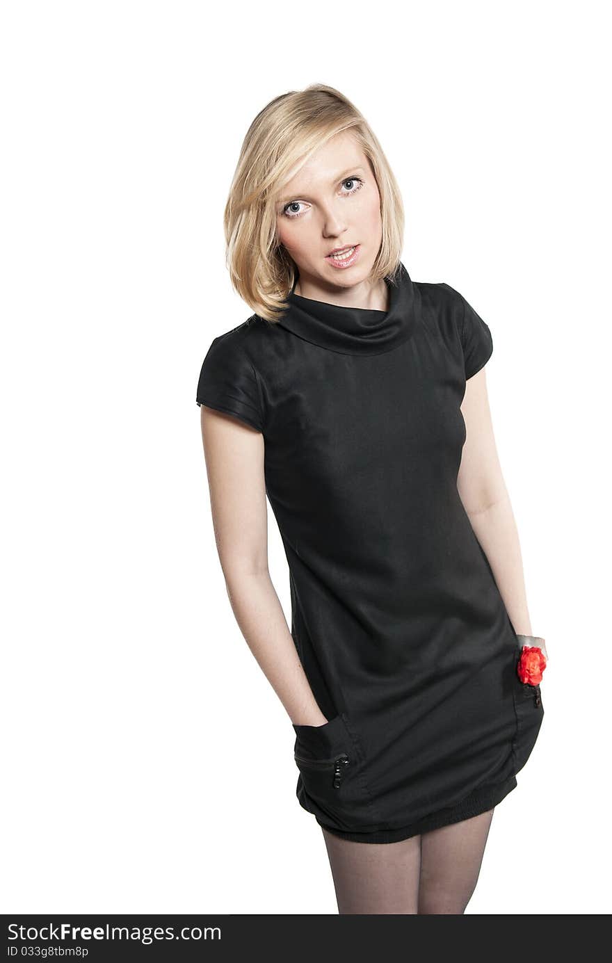 Young attractive woman in black dress. Studio photo of blonde woman on white background.