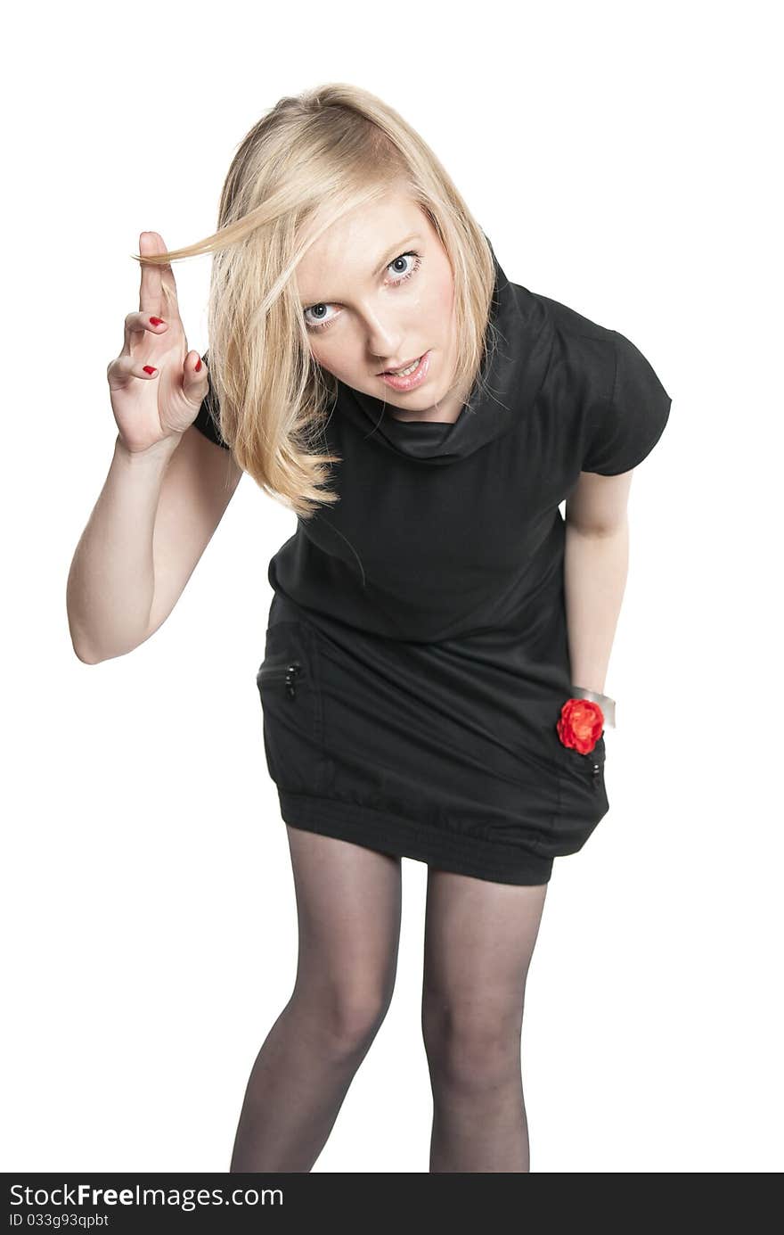 Young attractive woman in black dress.  Studio photo of blonde woman on white background.