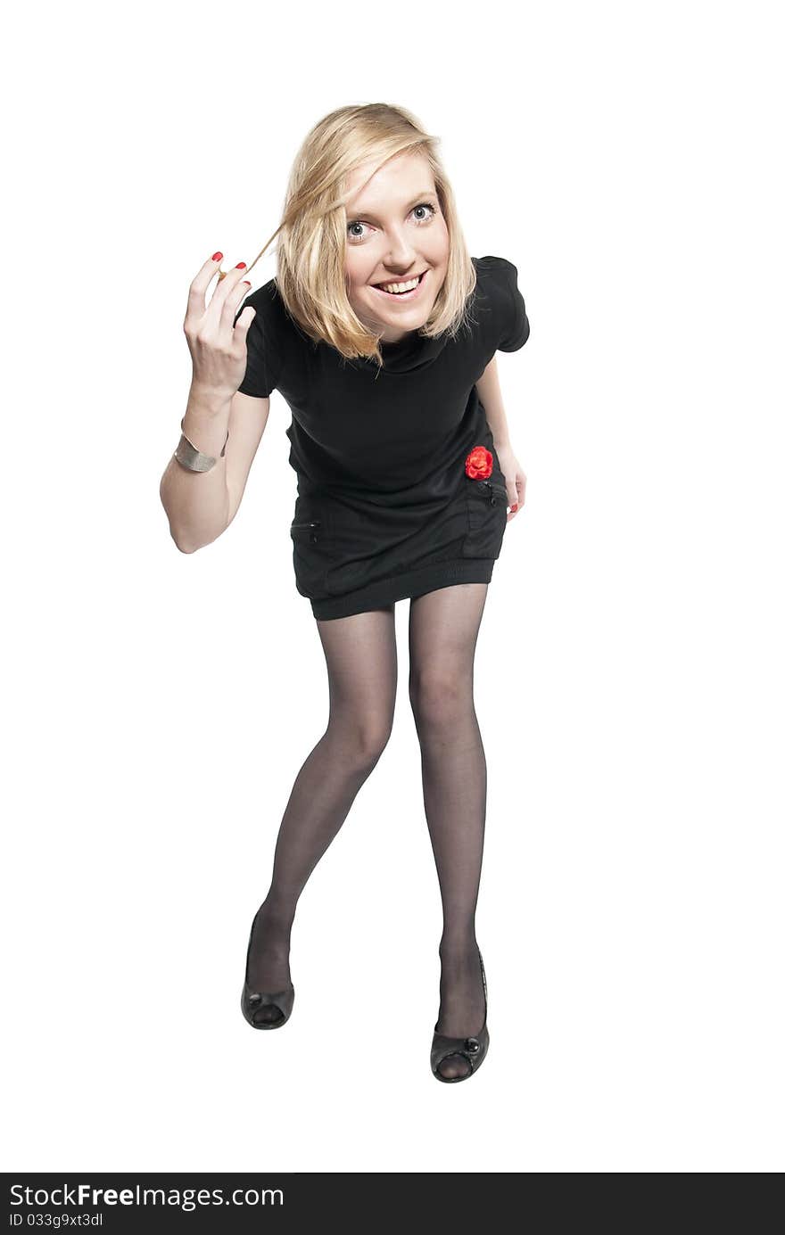 Young attractive woman in black dress.  Studio photo of blonde woman on white background.