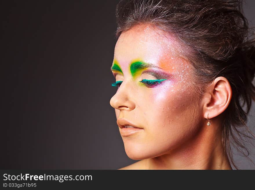 Girl with a creative make-up on face