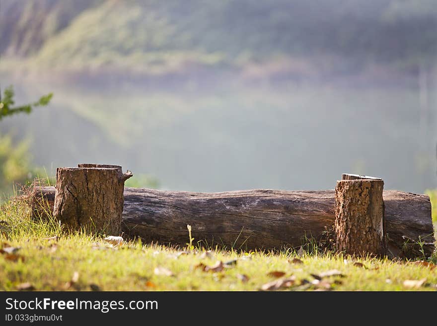 Log Bench On mountain in front of the river