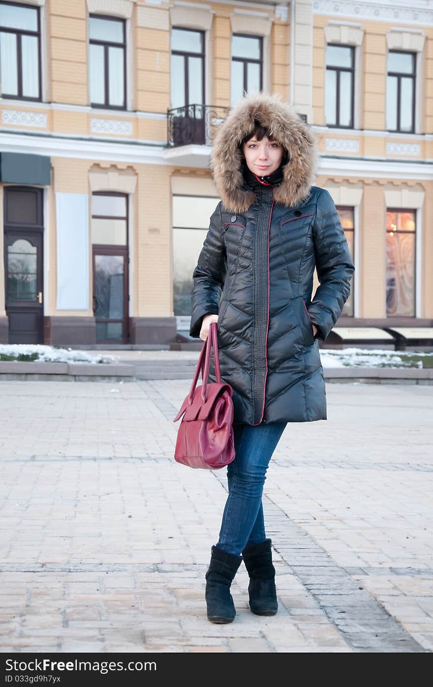 Girl in winter jacket on the street. Girl in winter jacket on the street