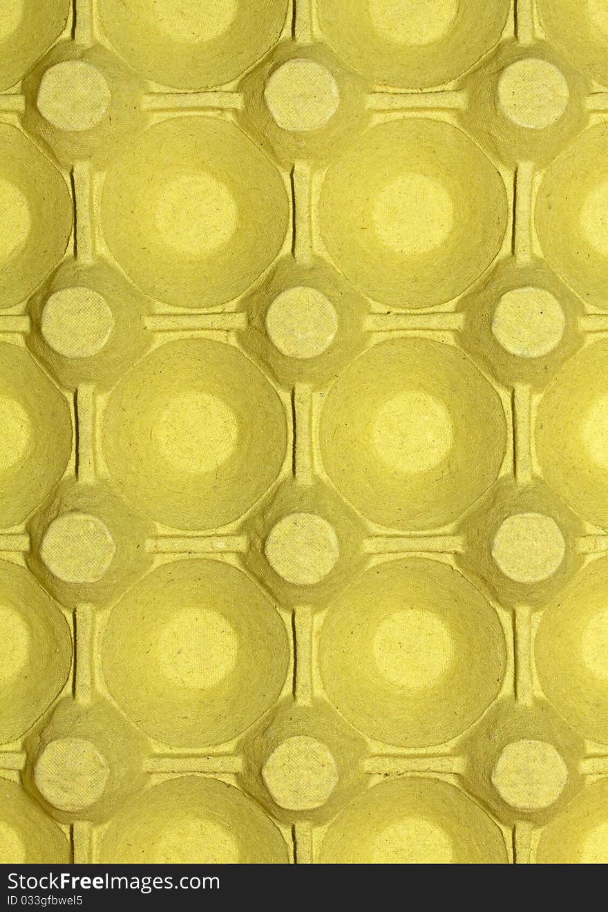 Close up view of yellow cardboard egg box. Close up view of yellow cardboard egg box