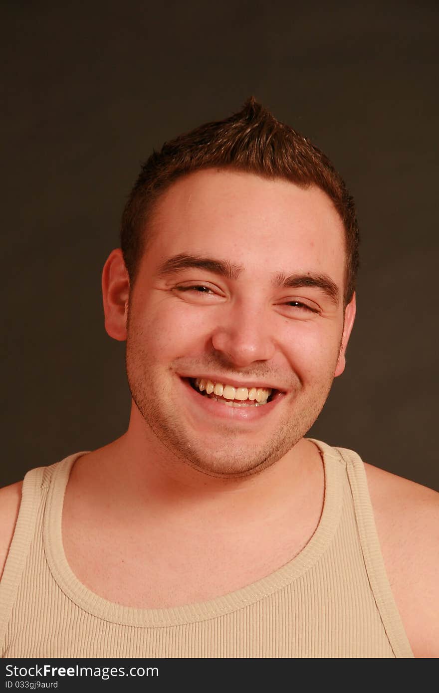 Portrait of a young man, Studio. Part of a grimace series, same model, different emotions.