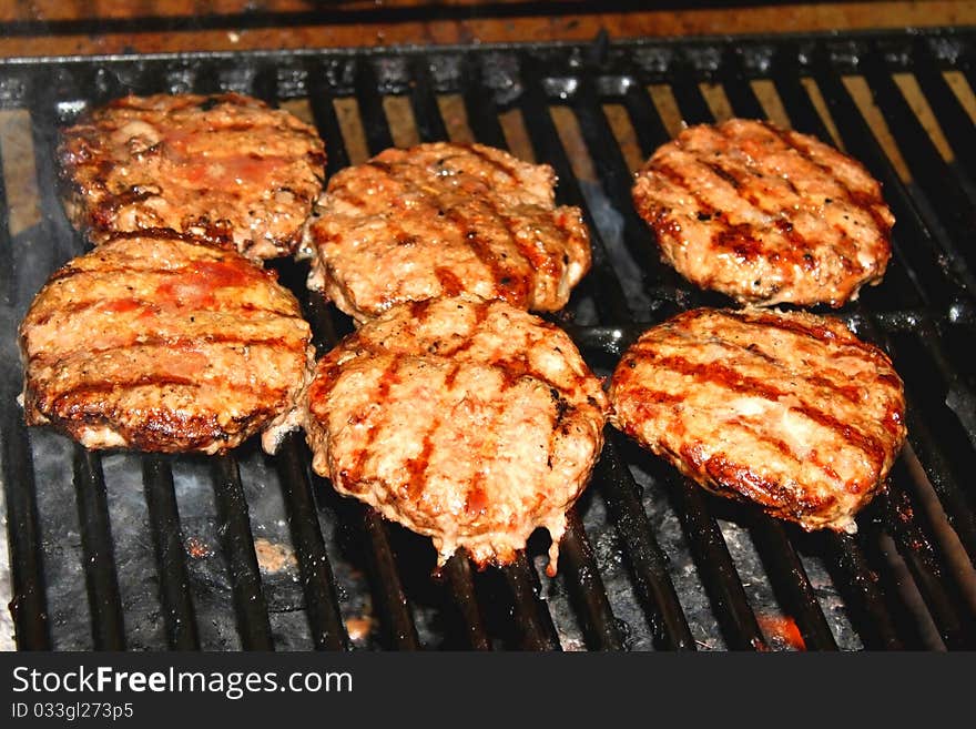 Hamburger patties on hot grill. Hamburger patties on hot grill