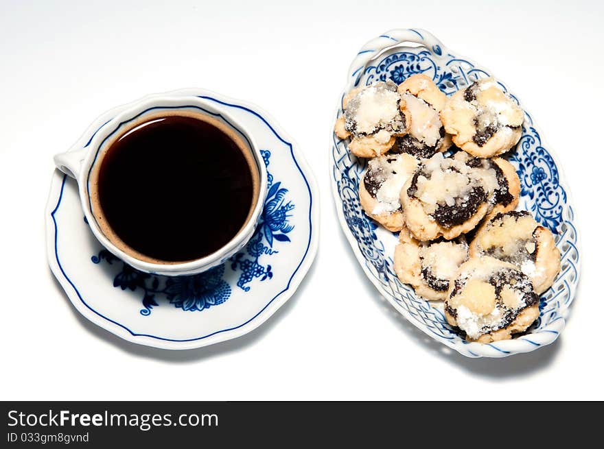 Cup of coffee with cakes, horizontal shot.