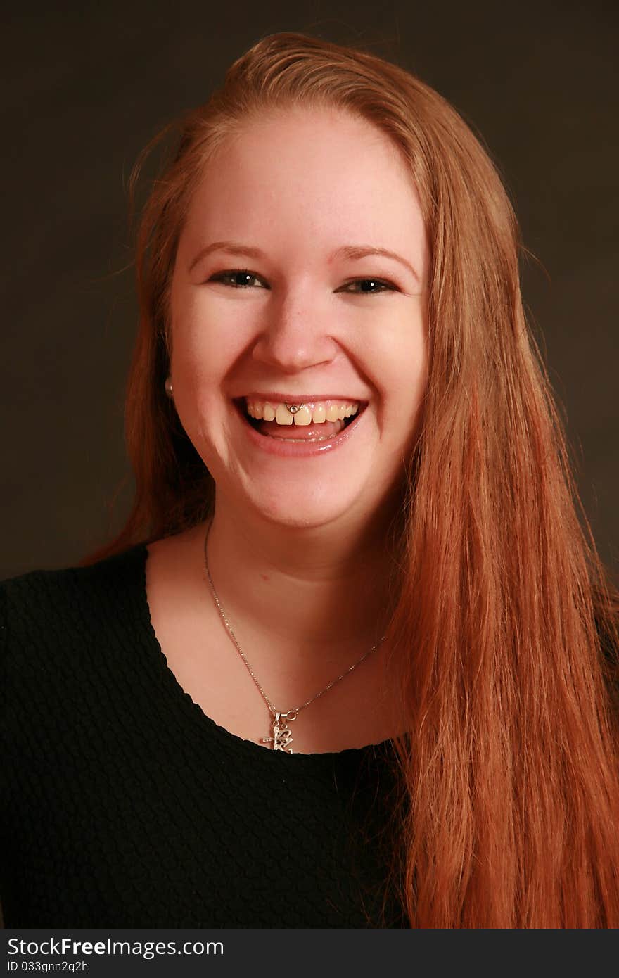 Portrait of a young woman, Studio. Part of a grimace series, same model, different emotions. Portrait of a young woman, Studio. Part of a grimace series, same model, different emotions.