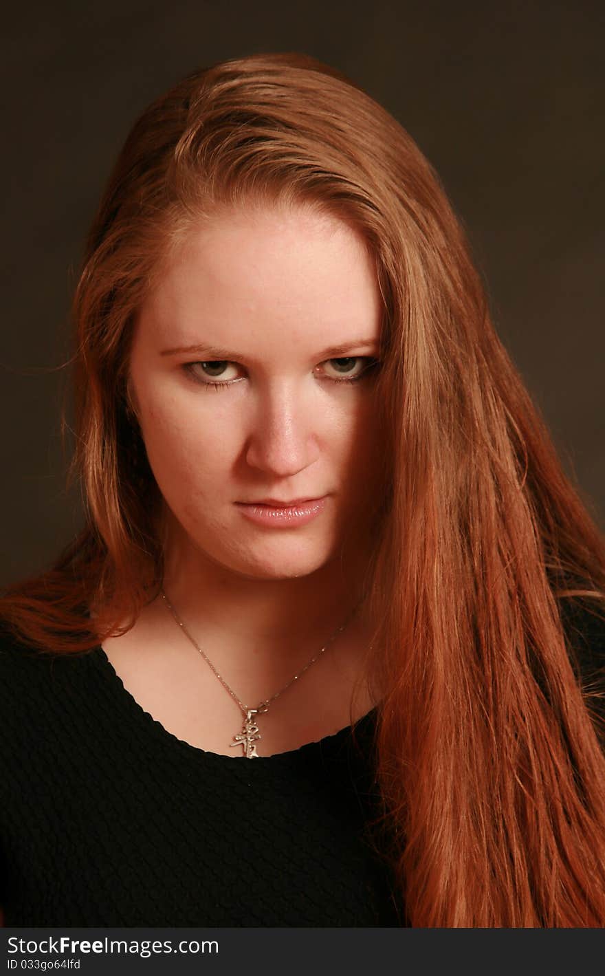 Portrait of a young woman, Studio. Part of a grimace series, same model, different emotions. Portrait of a young woman, Studio. Part of a grimace series, same model, different emotions.