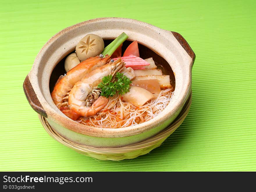 Claypot seafood Tom-Yam soup with rice noodle. Claypot seafood Tom-Yam soup with rice noodle