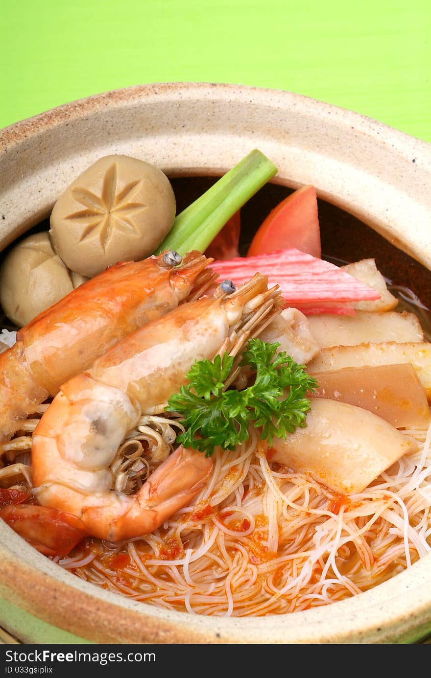 Claypot seafood Tom-Yam soup with rice noodle. Claypot seafood Tom-Yam soup with rice noodle