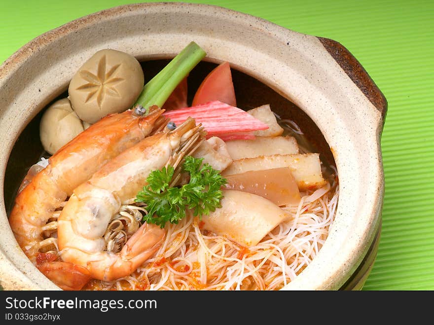 Claypot seafood Tom-Yam soup with rice noodle. Claypot seafood Tom-Yam soup with rice noodle