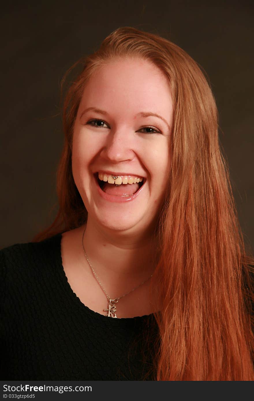 Portrait of a young woman, Studio. Part of a grimace series, same model, different emotions. Portrait of a young woman, Studio. Part of a grimace series, same model, different emotions.