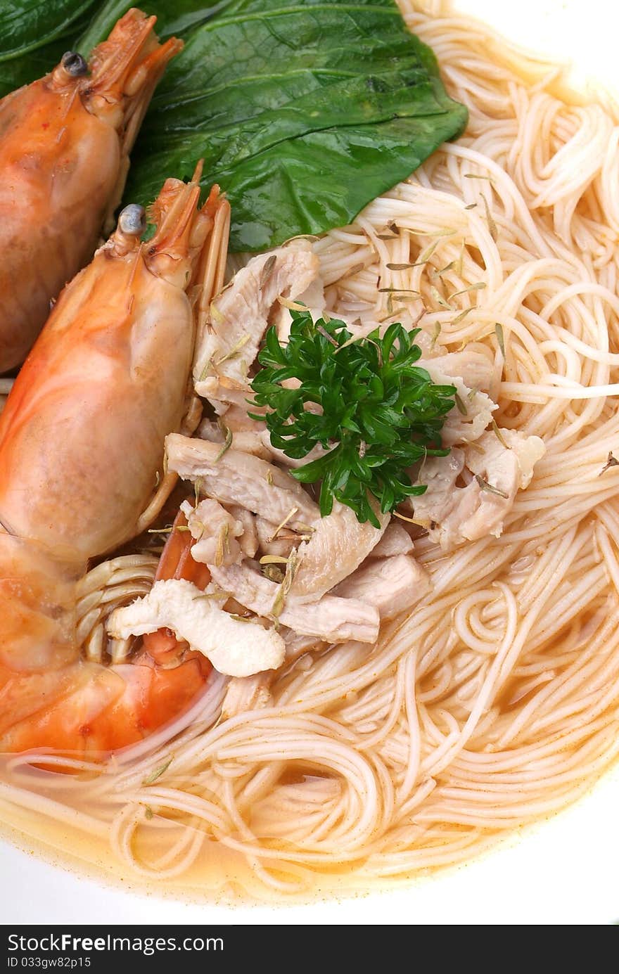 Chinese style seafood noodles in a white bowl