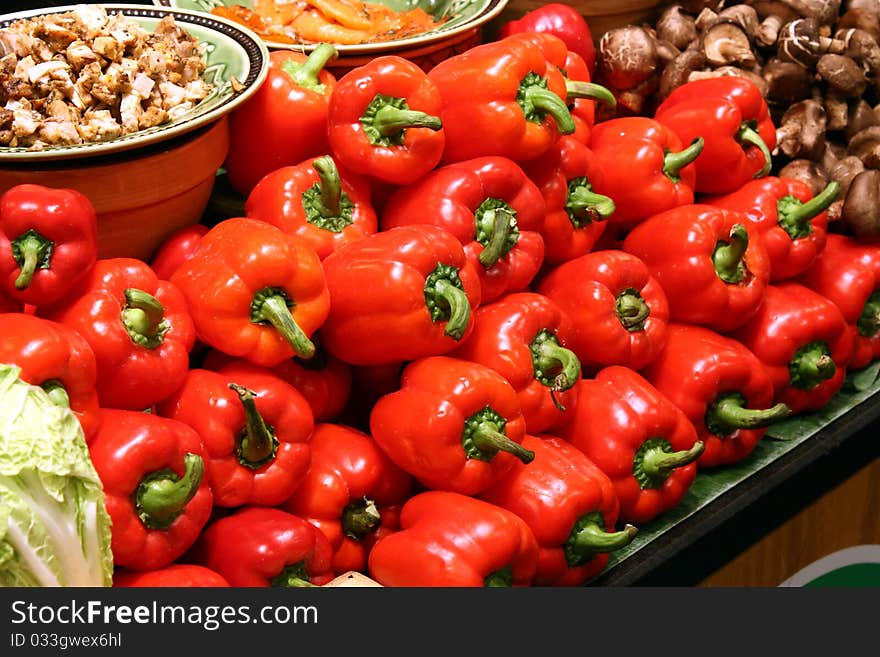 Rows of Red Capsicums on Display at a Marketplace