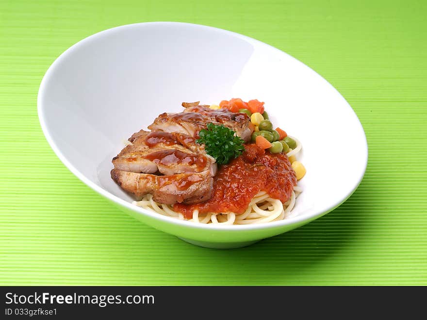 A plate of pasta with onion and spice gravy