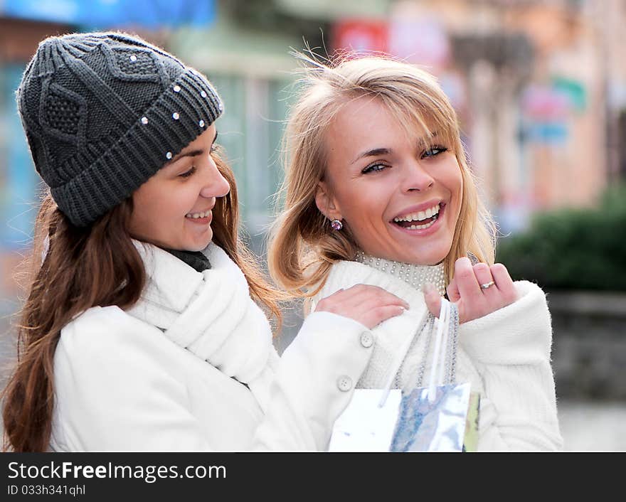 Cheerful girls twins, in the street