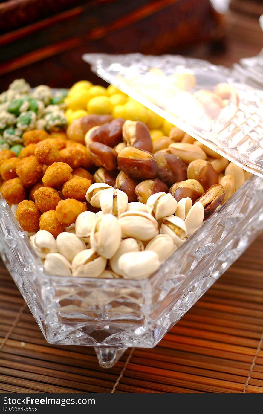 Assortment of asian nuts on jug