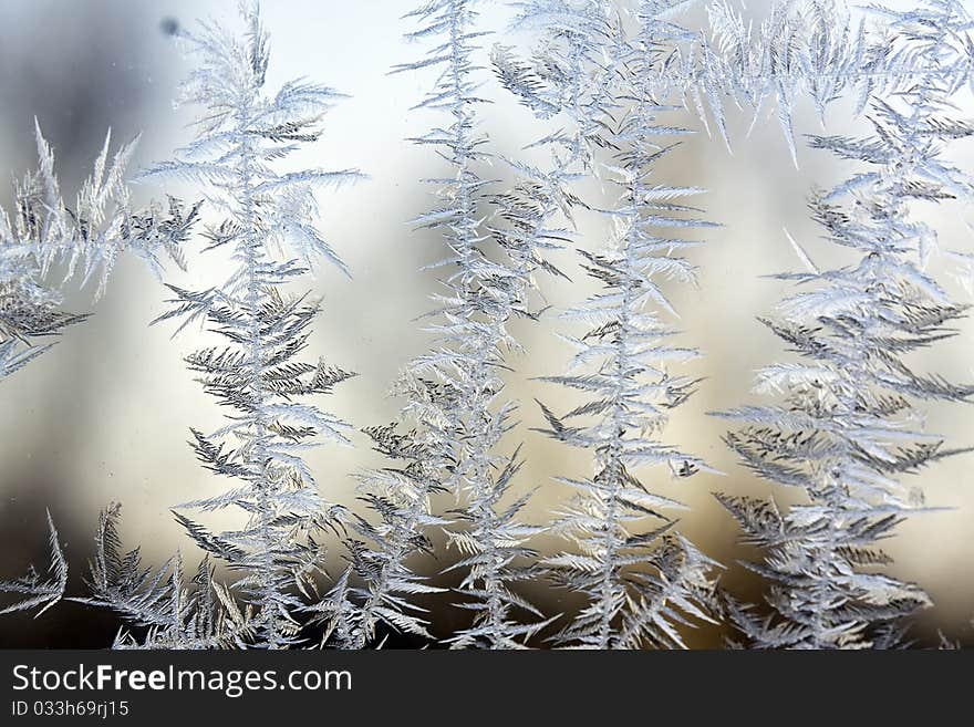 Frozen glass of a window, cold in the winter