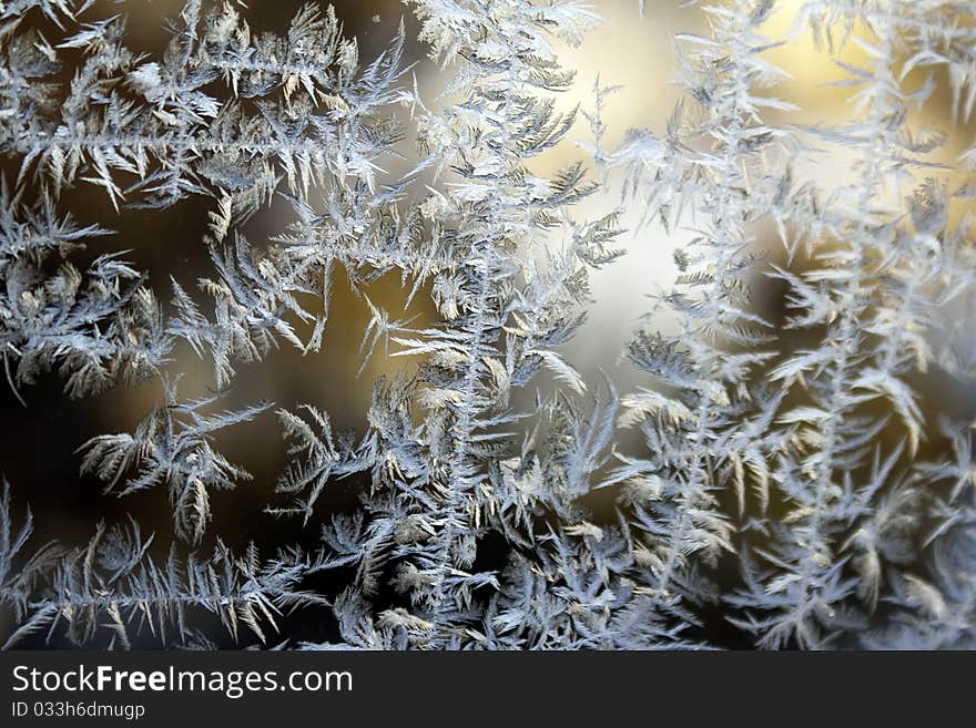 Frozen glass of a window, cold in the winter