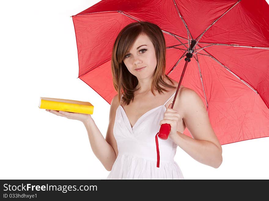 A close up of a woman holding her red umbrella and her yellow book. A close up of a woman holding her red umbrella and her yellow book.