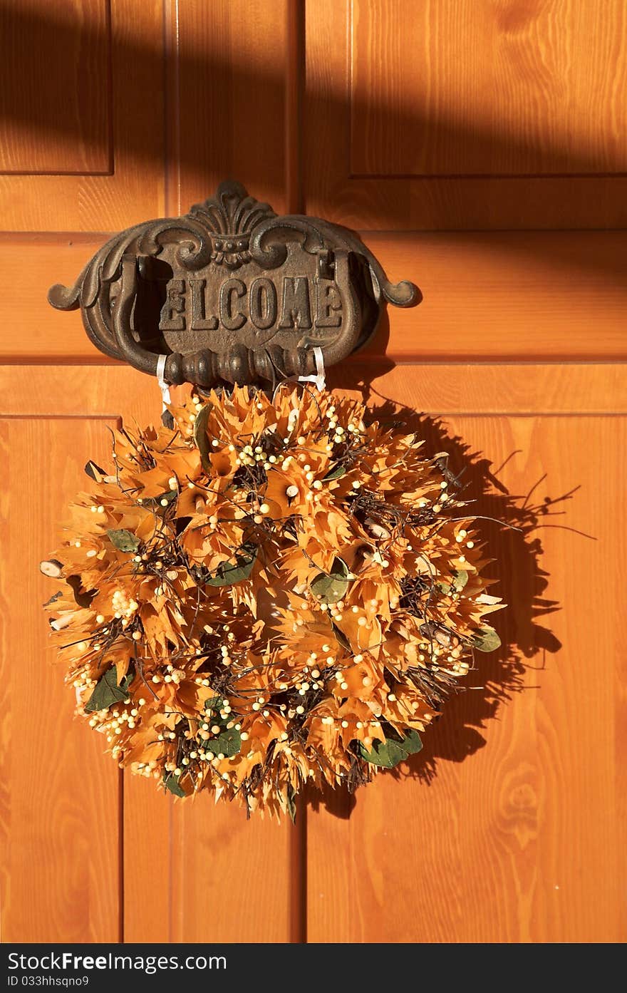 Wooden door of home, welcome sign with knocker. Wooden door of home, welcome sign with knocker