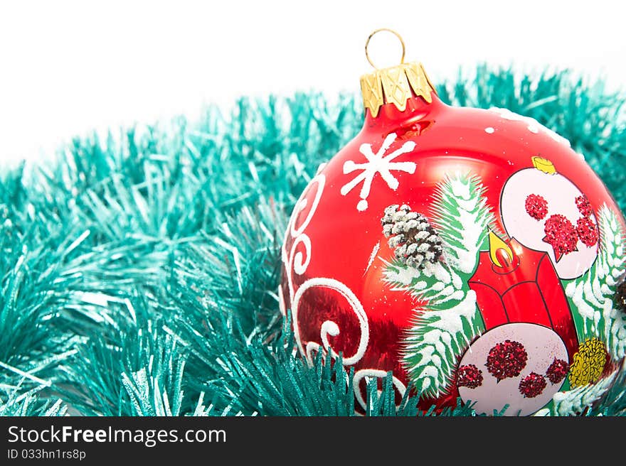 Christmas-tree glass decorations. Red ball isolated. Textured surface.