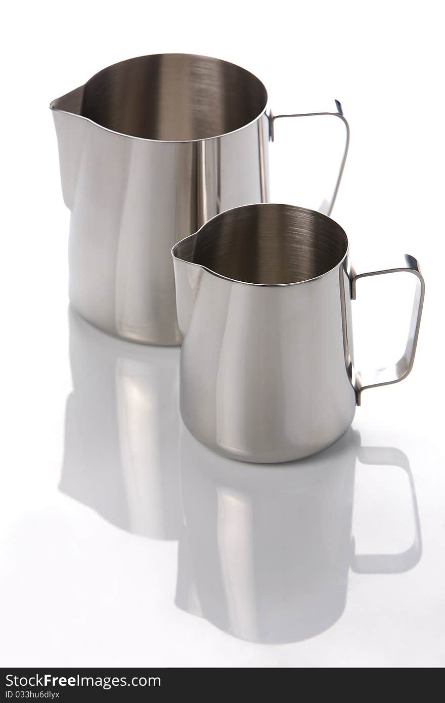 Two metal jugs