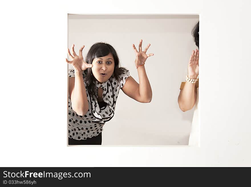 Scary Indian lady with polka top on a light background. Scary Indian lady with polka top on a light background