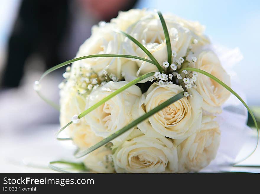 Beautiful bouquet of the bride executed from light beige roses