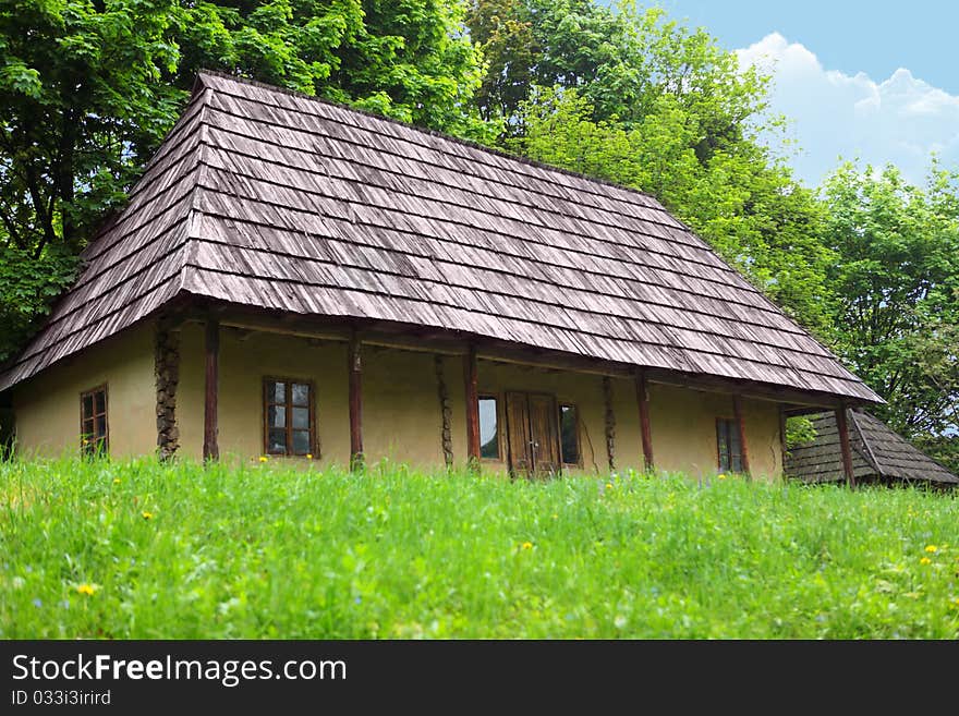 The wooden house located on the fringe of the forest. The wooden house located on the fringe of the forest.