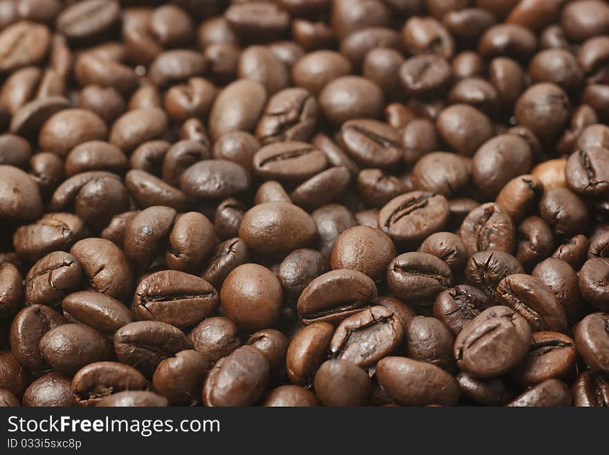 Roasted coffee beans closeup background