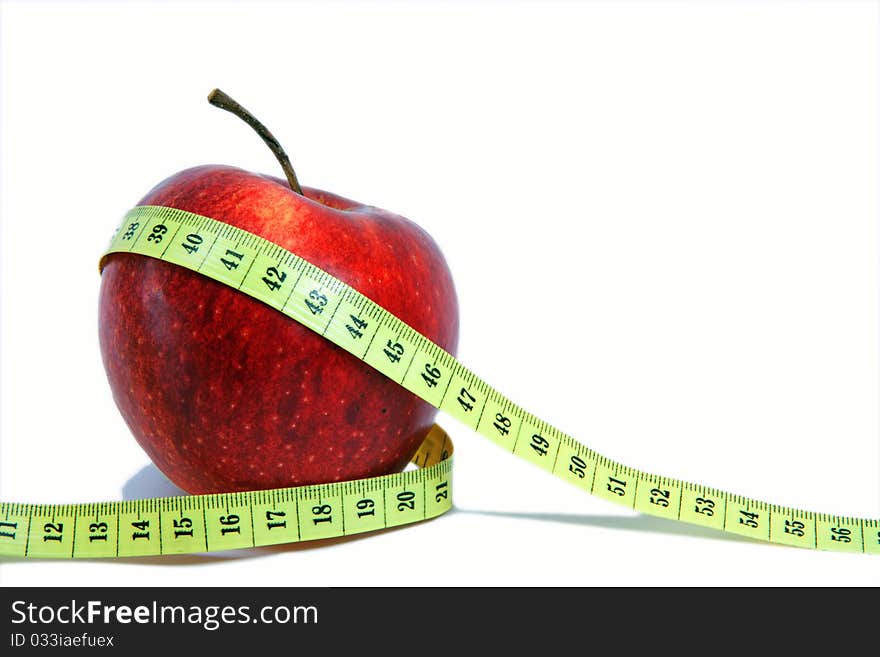 Apple with a measuring tape around. Apple with a measuring tape around