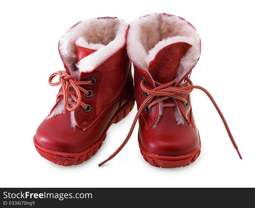 Two red children's boots on a white background. Two red children's boots on a white background