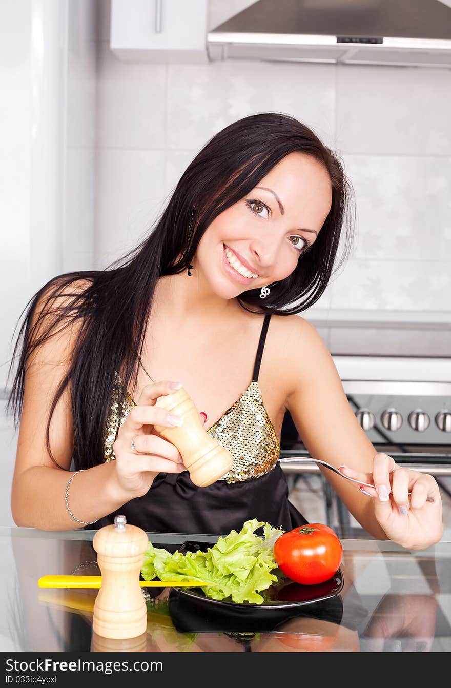 Woman eating vegetables