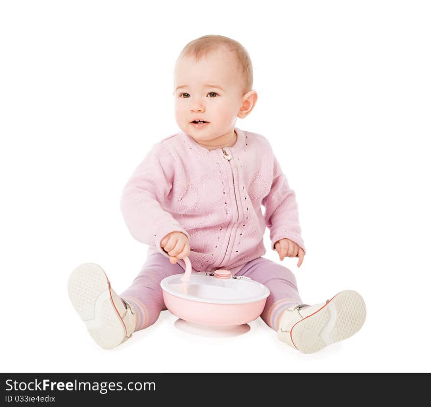 Happy baby with plate and spoon