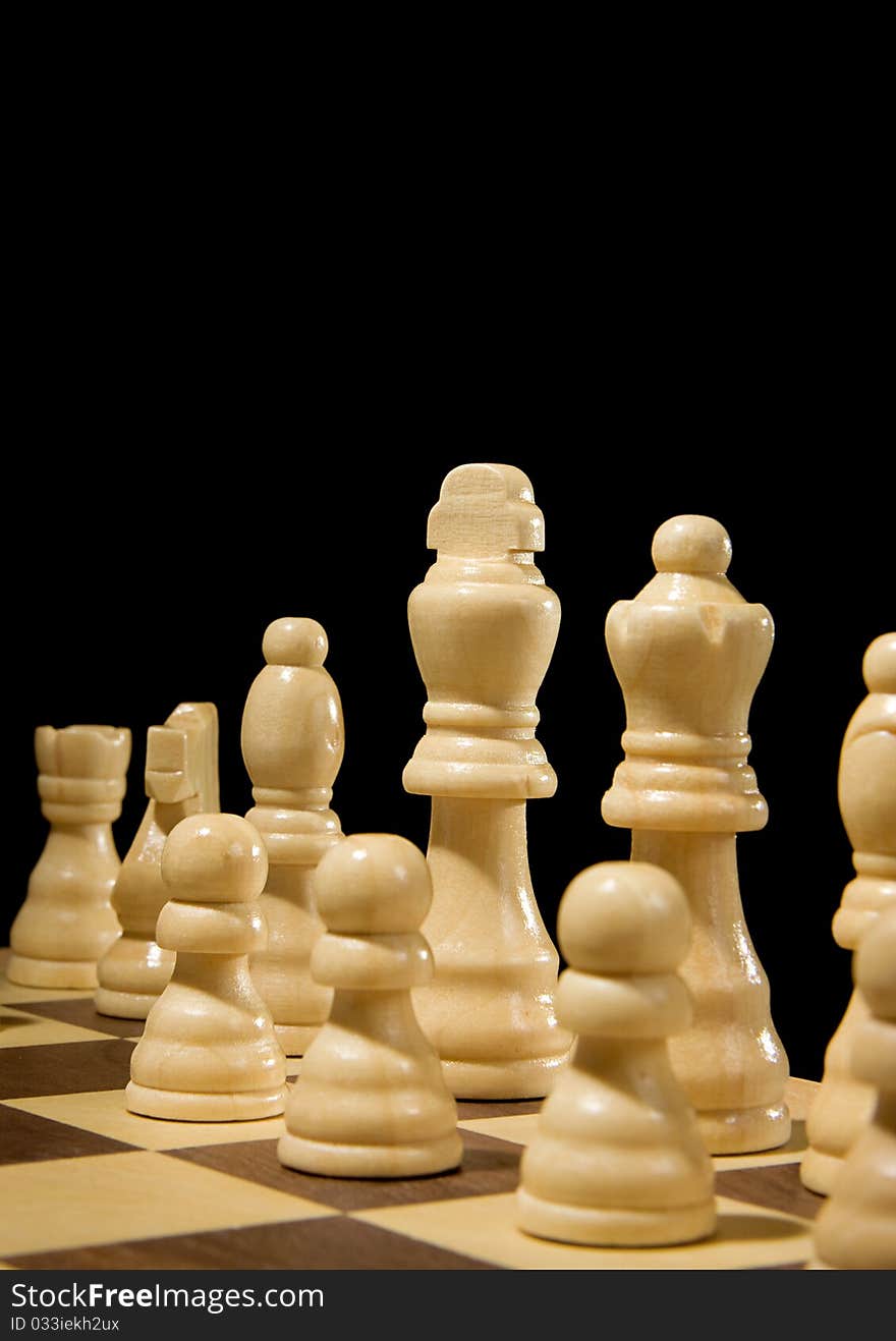 Chess piece on board isolated on black background