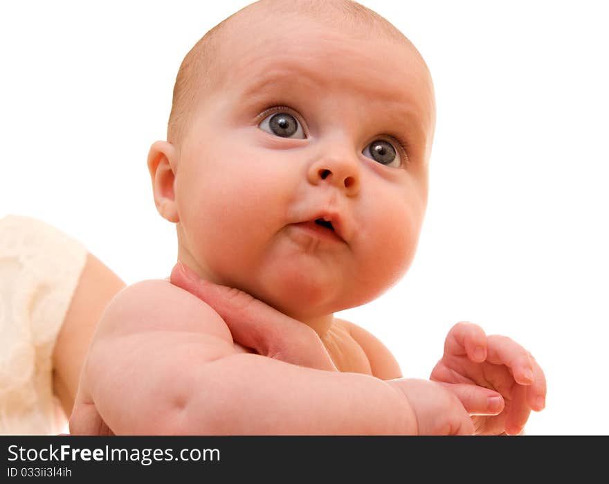 Surprised kid looks at a white background.