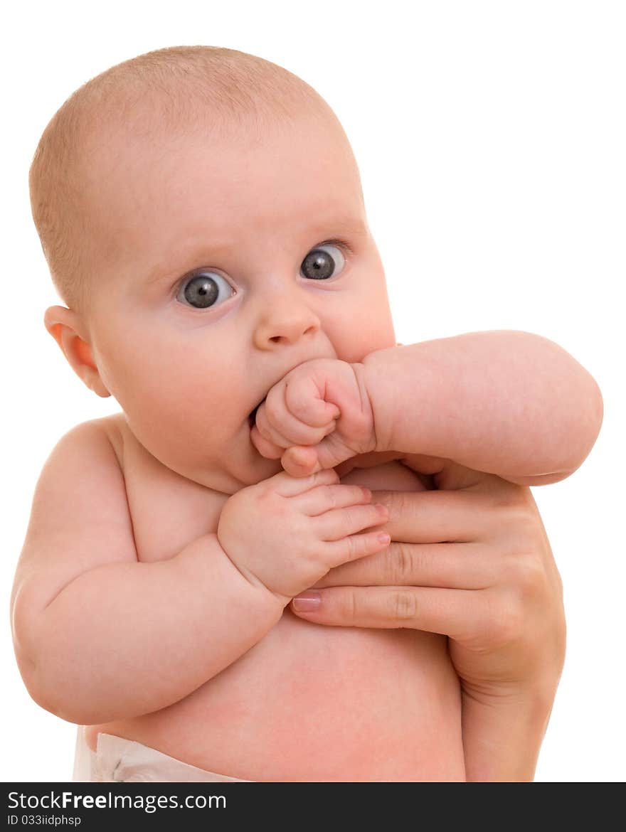 Surprised kid looks at a white background.