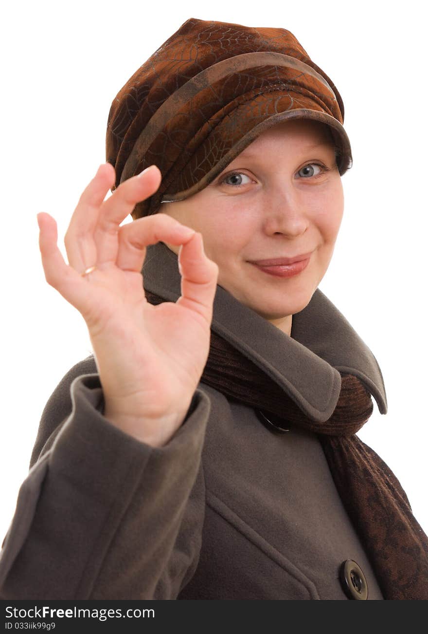 A girl in winter clothes on a white background.