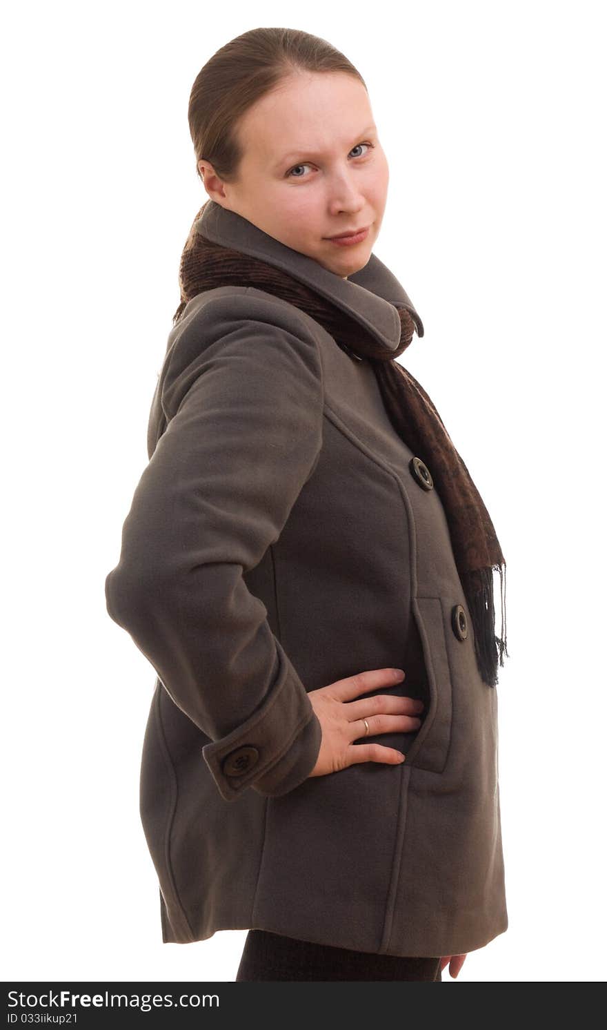 A girl in winter clothes on a white background.