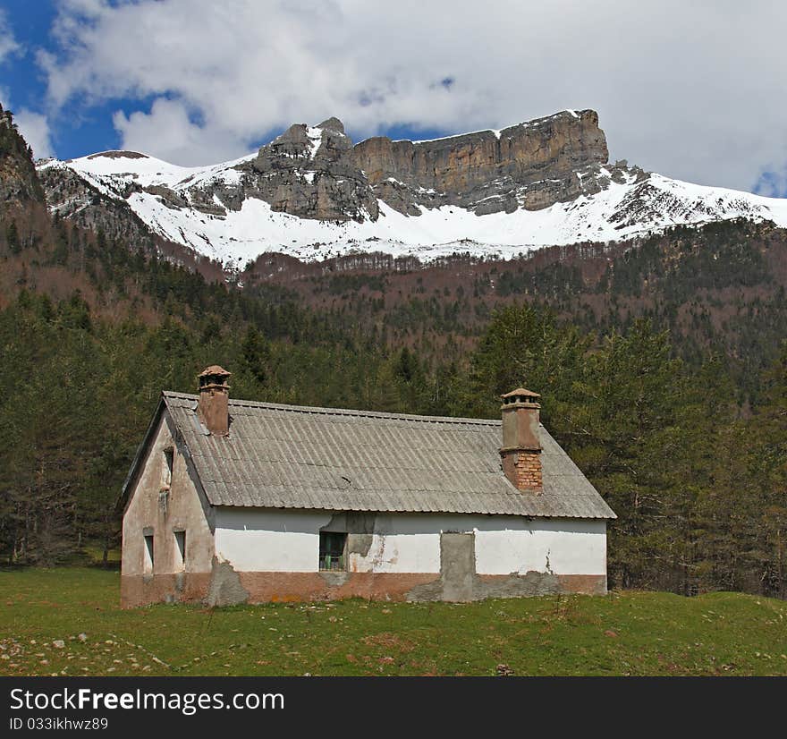 Hut And Snow-covered Mountains In Pyrenees