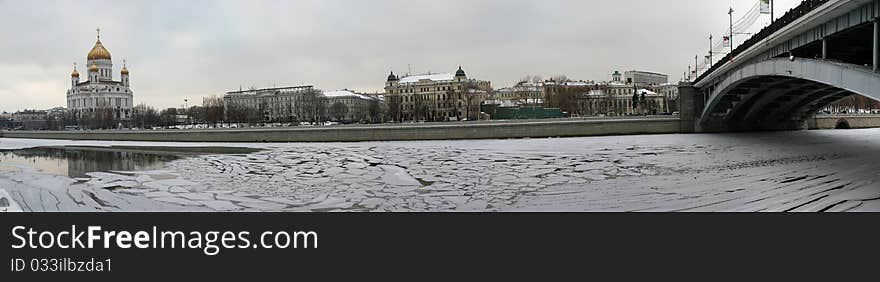 Panoramic view of the Moscow River, Cathedral of Christ the Savior and the Great Stone Bridge on a cloudy winter day, Moscow, Russia