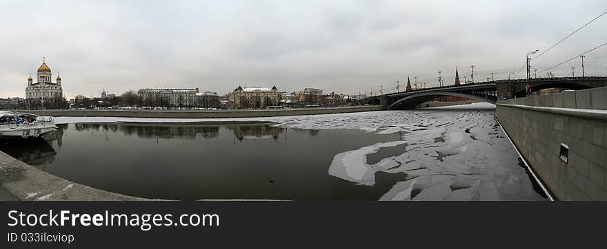 Panoramic view of the Moscow River, Cathedral of Christ the Savior and the Great Stone Bridge on a cloudy winter day, Moscow, Russia. Panoramic view of the Moscow River, Cathedral of Christ the Savior and the Great Stone Bridge on a cloudy winter day, Moscow, Russia