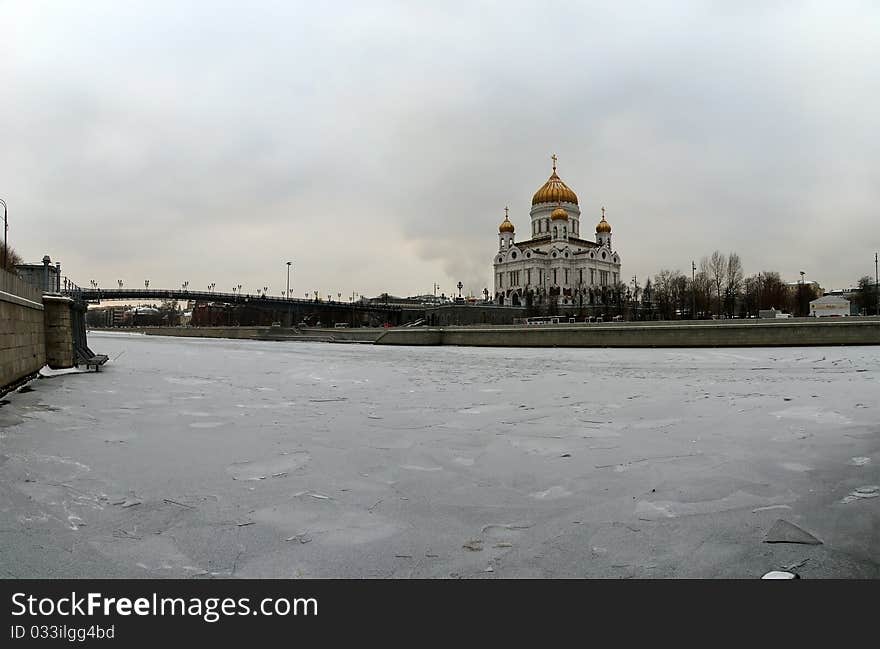 Panoramic view of the Moscow River, Cathedral of Christ the Savior and the Great Stone Bridge on a cloudy winter day, Moscow, Russia. Panoramic view of the Moscow River, Cathedral of Christ the Savior and the Great Stone Bridge on a cloudy winter day, Moscow, Russia